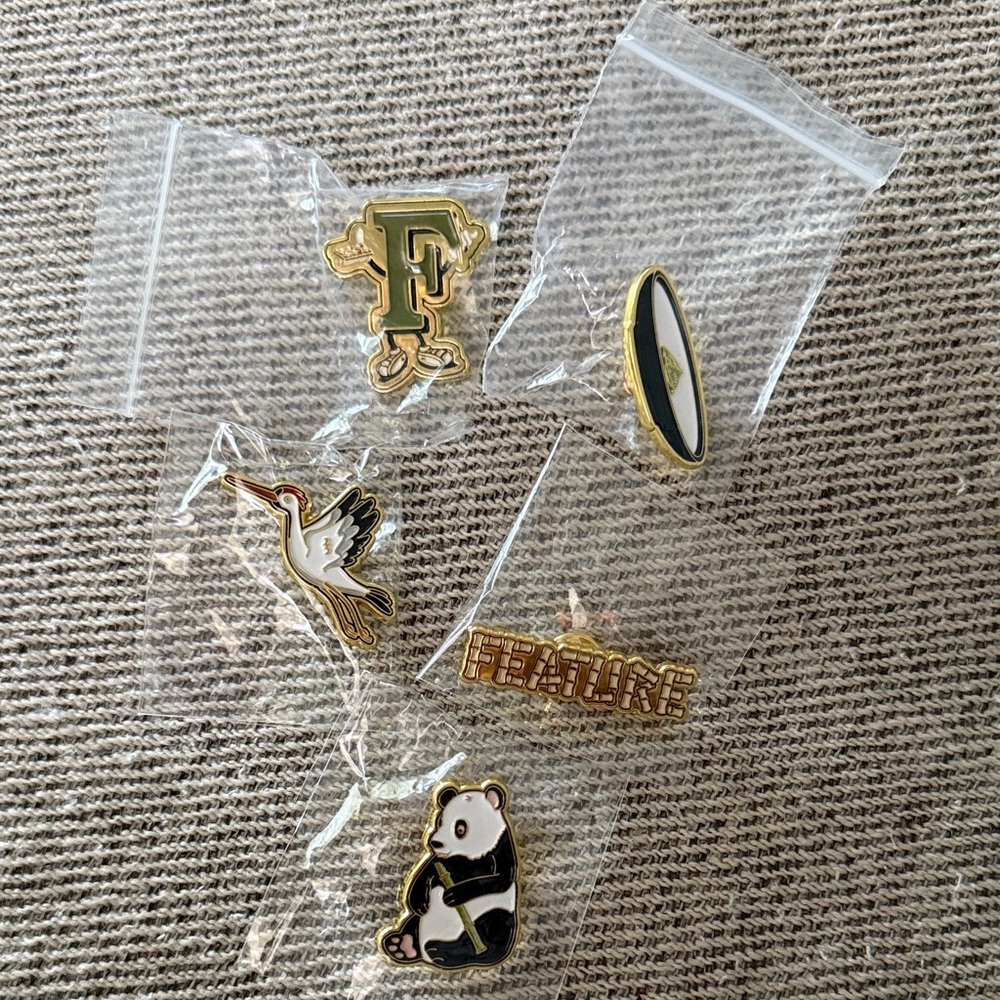 FEATURE pins , five , NWOT